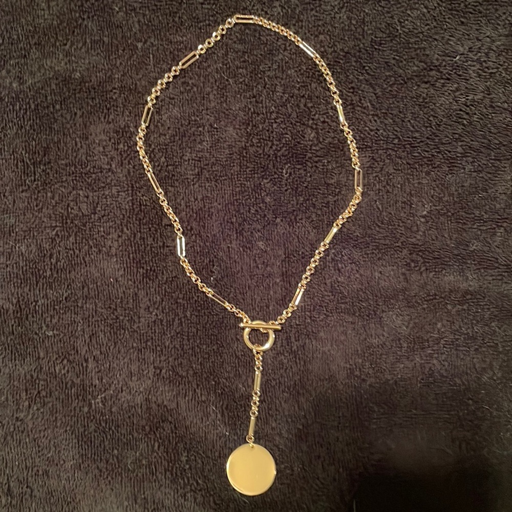Gold colour necklace with plain medallion